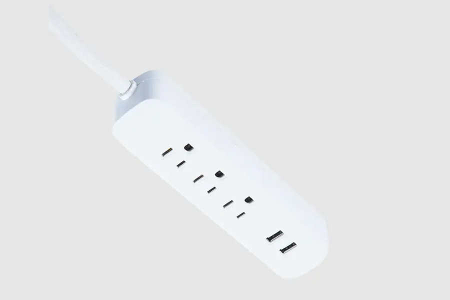 How do American power strips achieve surge protection?